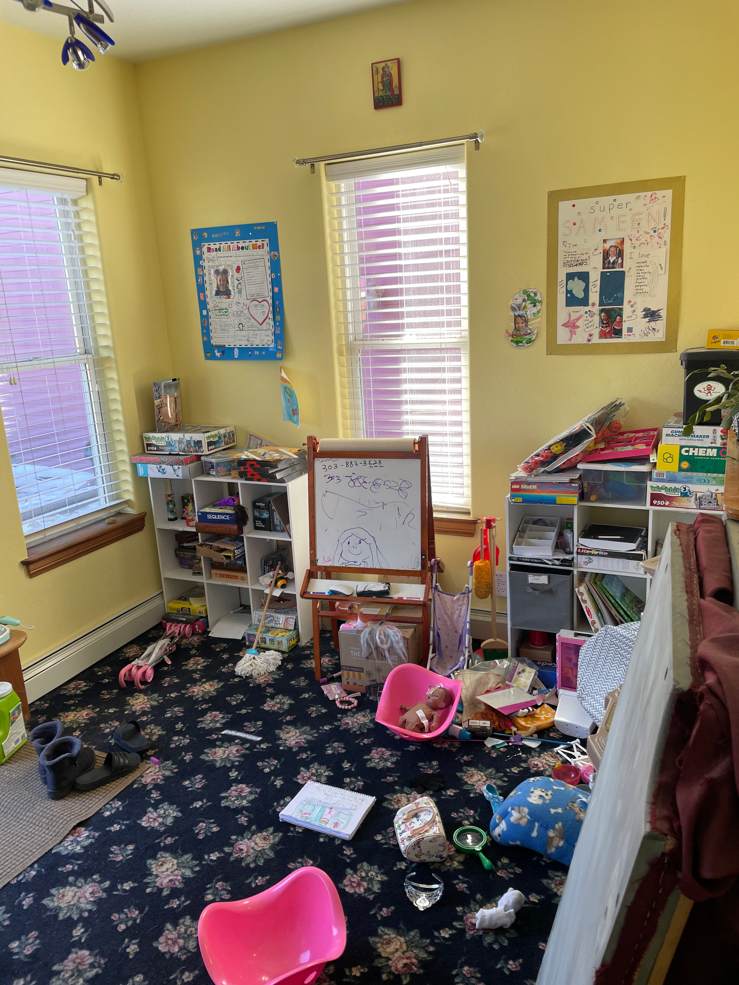 Before image of a typical playroom of a girl under 10 with many colorful toys strewn about the space.
