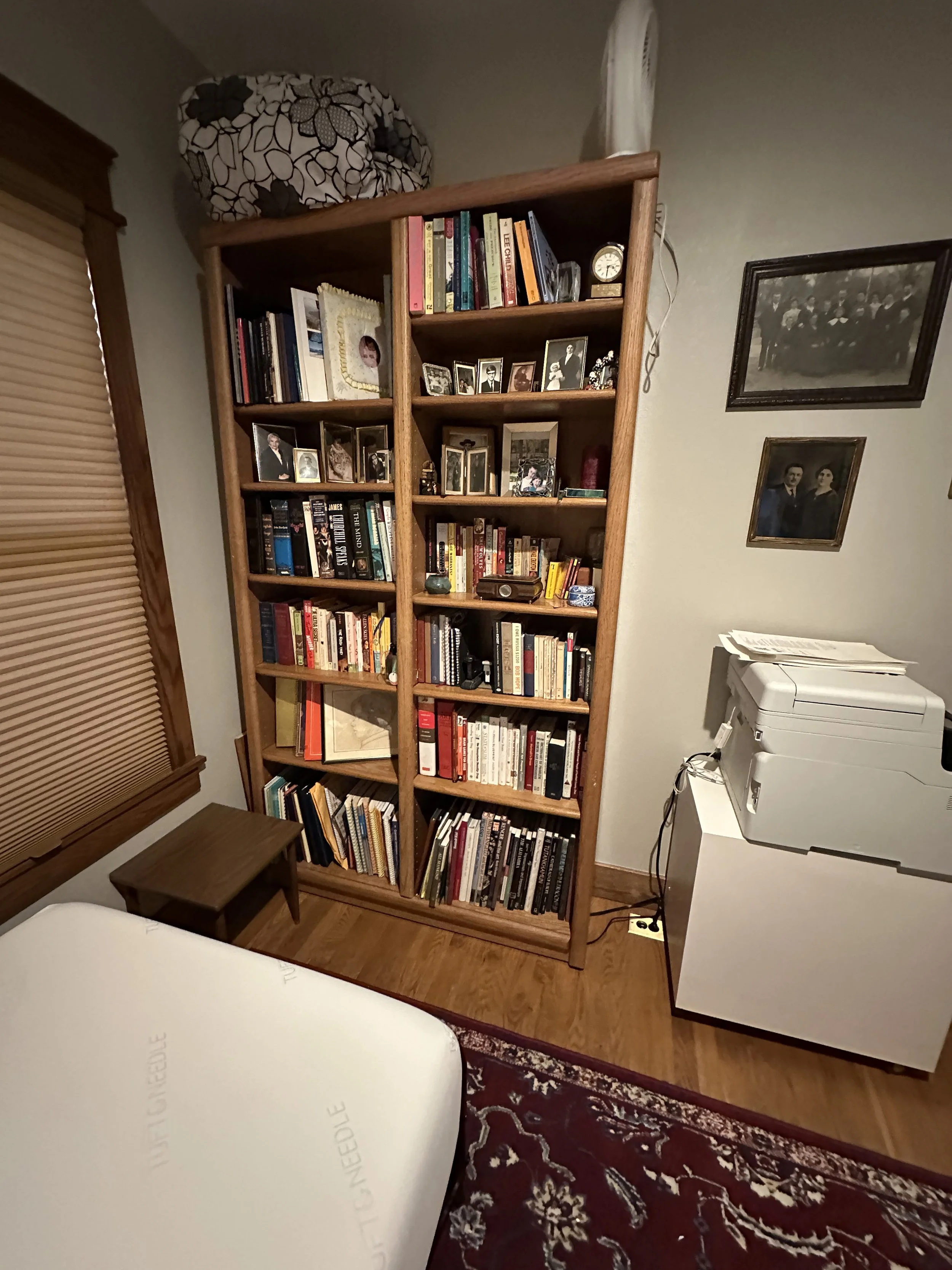 After image of a professionally organized spare room with nostalgic items handled with care and bookcase organized and fully utilized in Denver, CO.