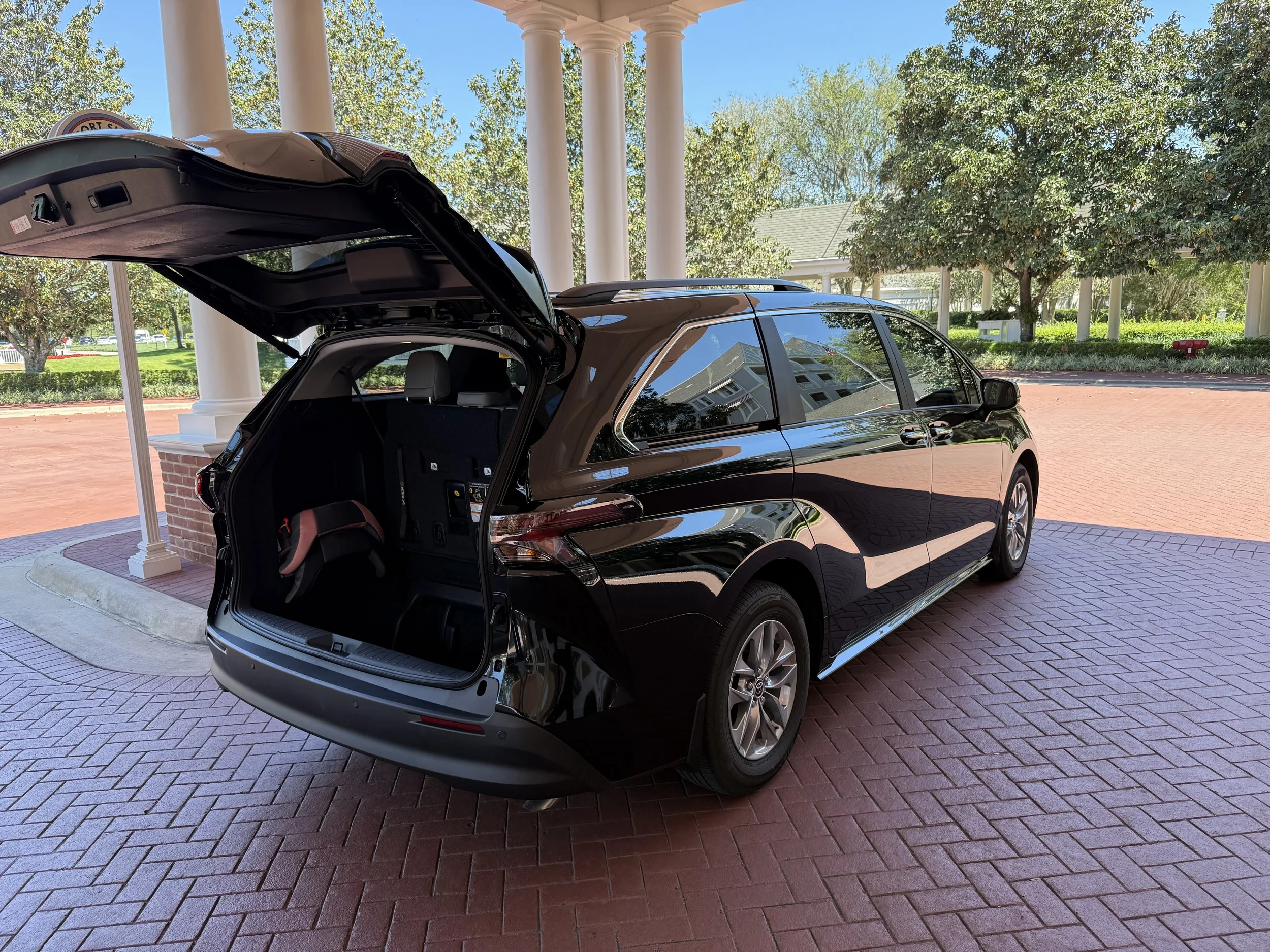 Toyota Sienna with rear tailgate door open at boardwalk