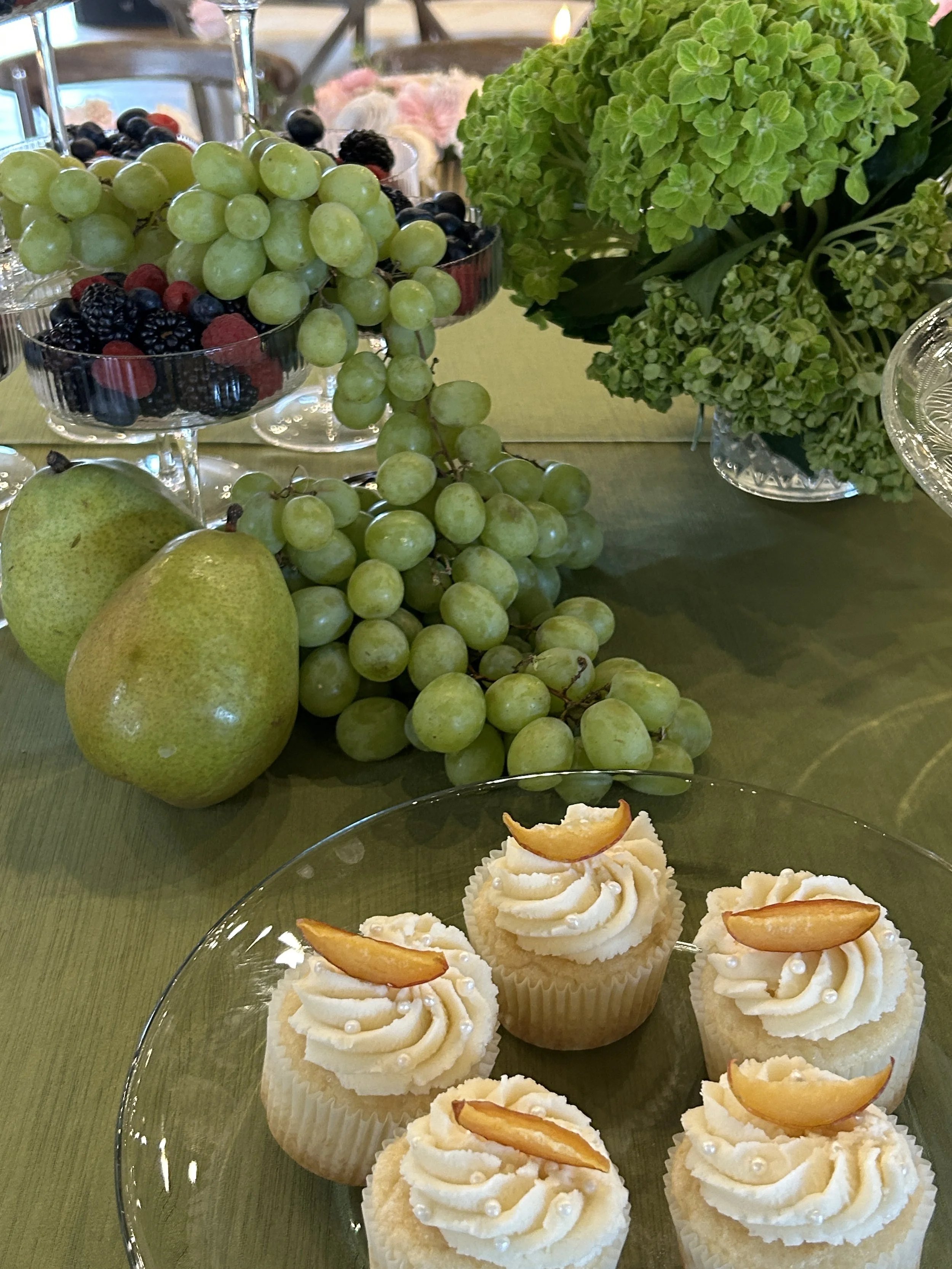 Vintage camper with photo booth sign, illuminated lights, open door, forest background.