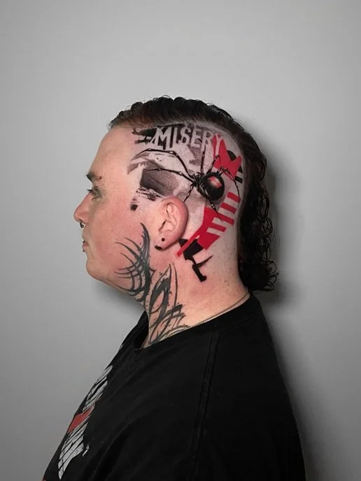 Black and red tattoo with spider on head