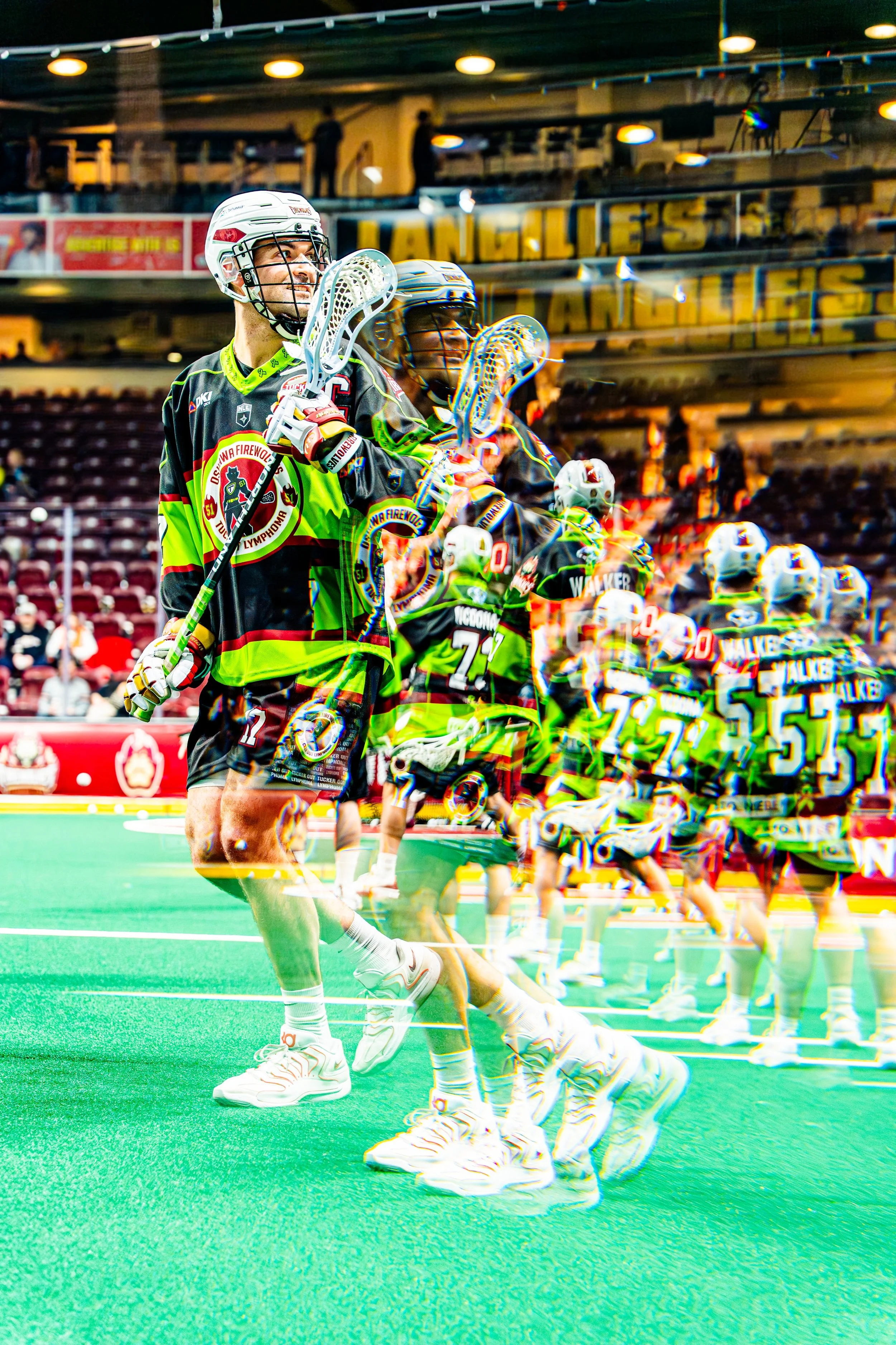 Hockey players standing in a line on the field, with the words "Los Angeles" visible in the background, during a game or practice session.
