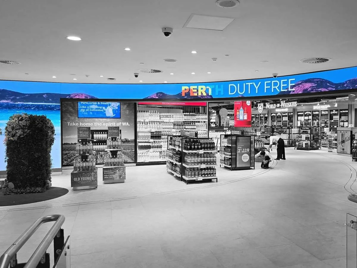 Curved LED display above the Avolta Duty Free store at Perth Airport.