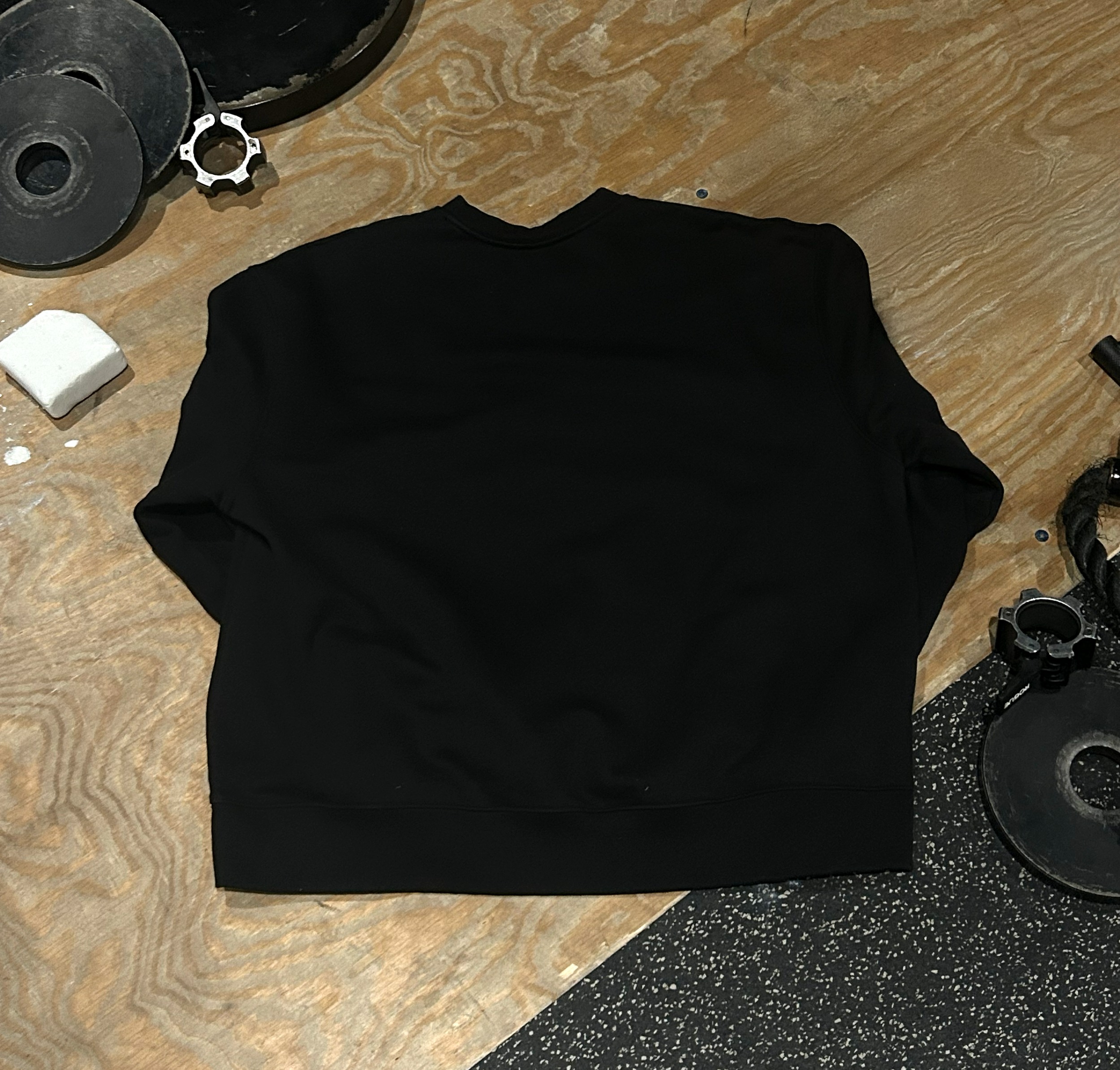 Crewneck-On-Ground-Black-Back-Final.png