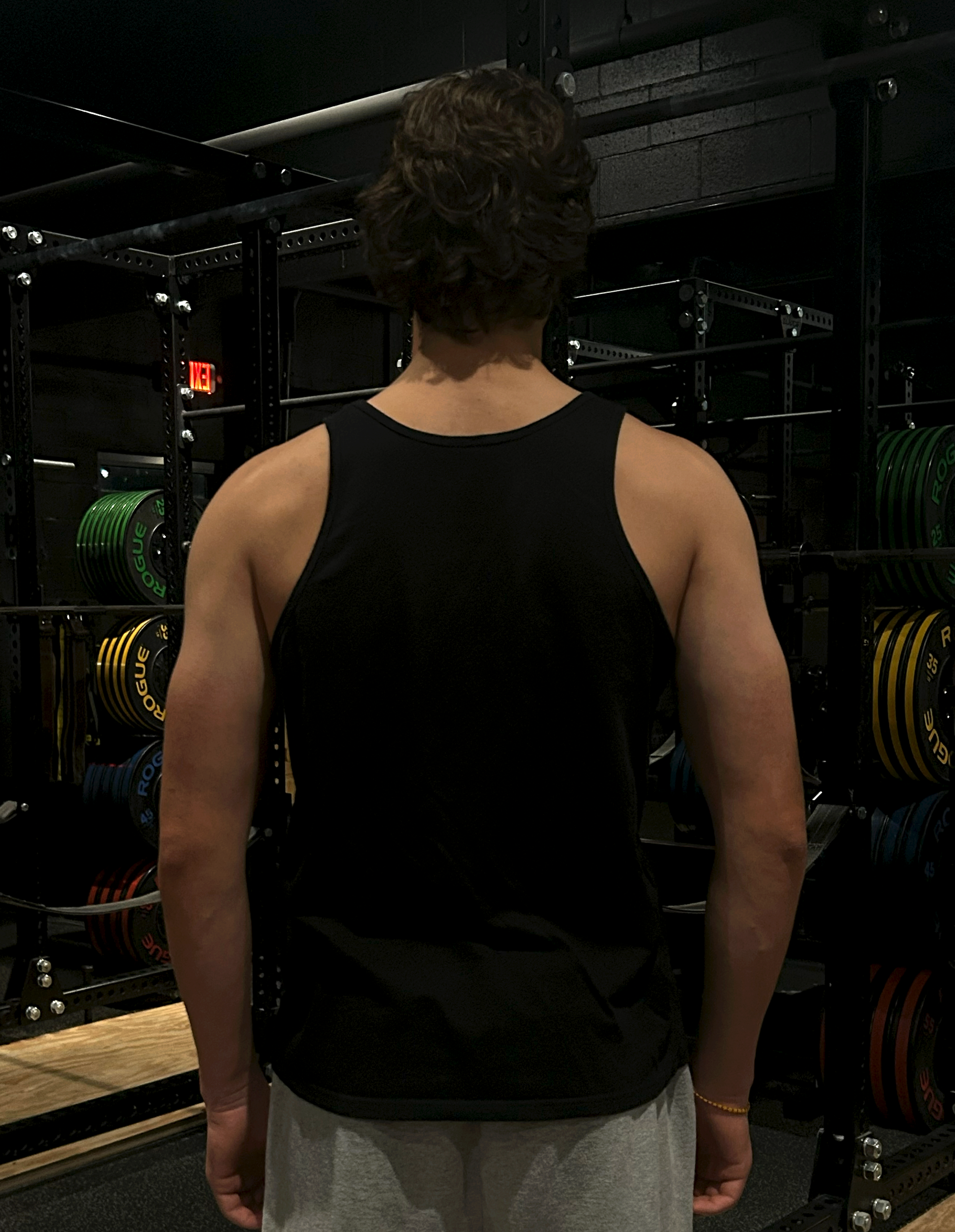Tanktop-On-Person-Black-Back-Final.png
