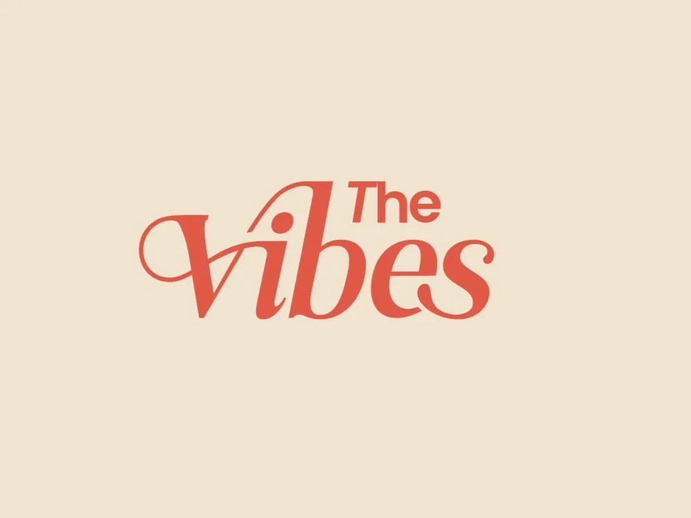 Graphic with the text 'The Vibes' in a stylized red font on a beige background.