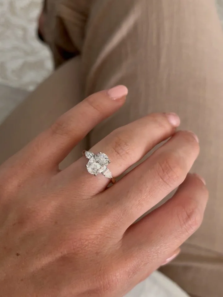 SUPER excited for this jaw dropping engagement ring we created for Lauren &amp; Mark ❤️&zwj;🔥

Featuring a superb oval cut diamond, set in 18 carat yellow gold and framed by two perfectly proportioned pear cut diamonds on either side ✨

A pleasure f