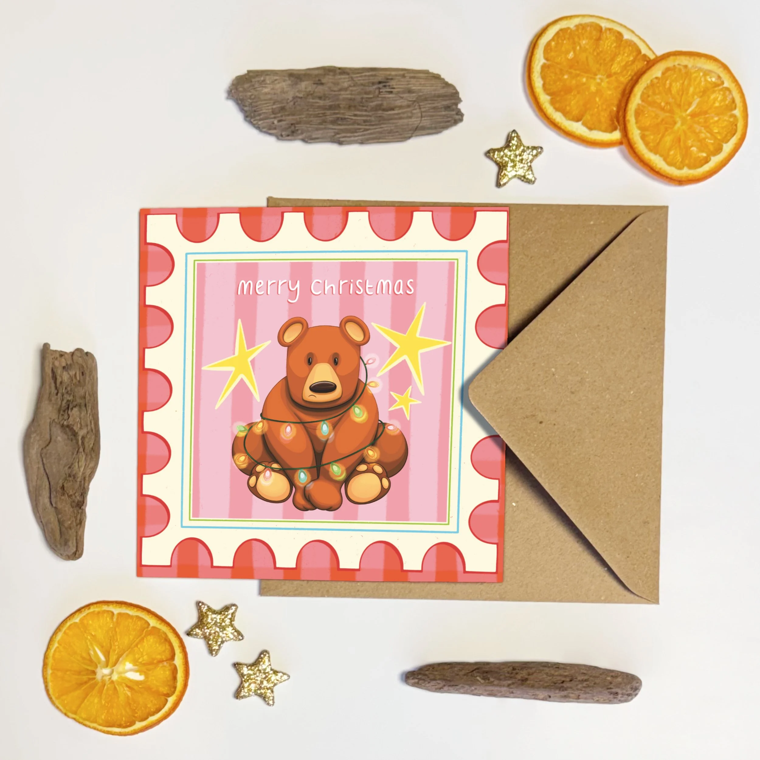 Bear wrapped in coloured lights yellow stars postage stamp illustrated Christmas card