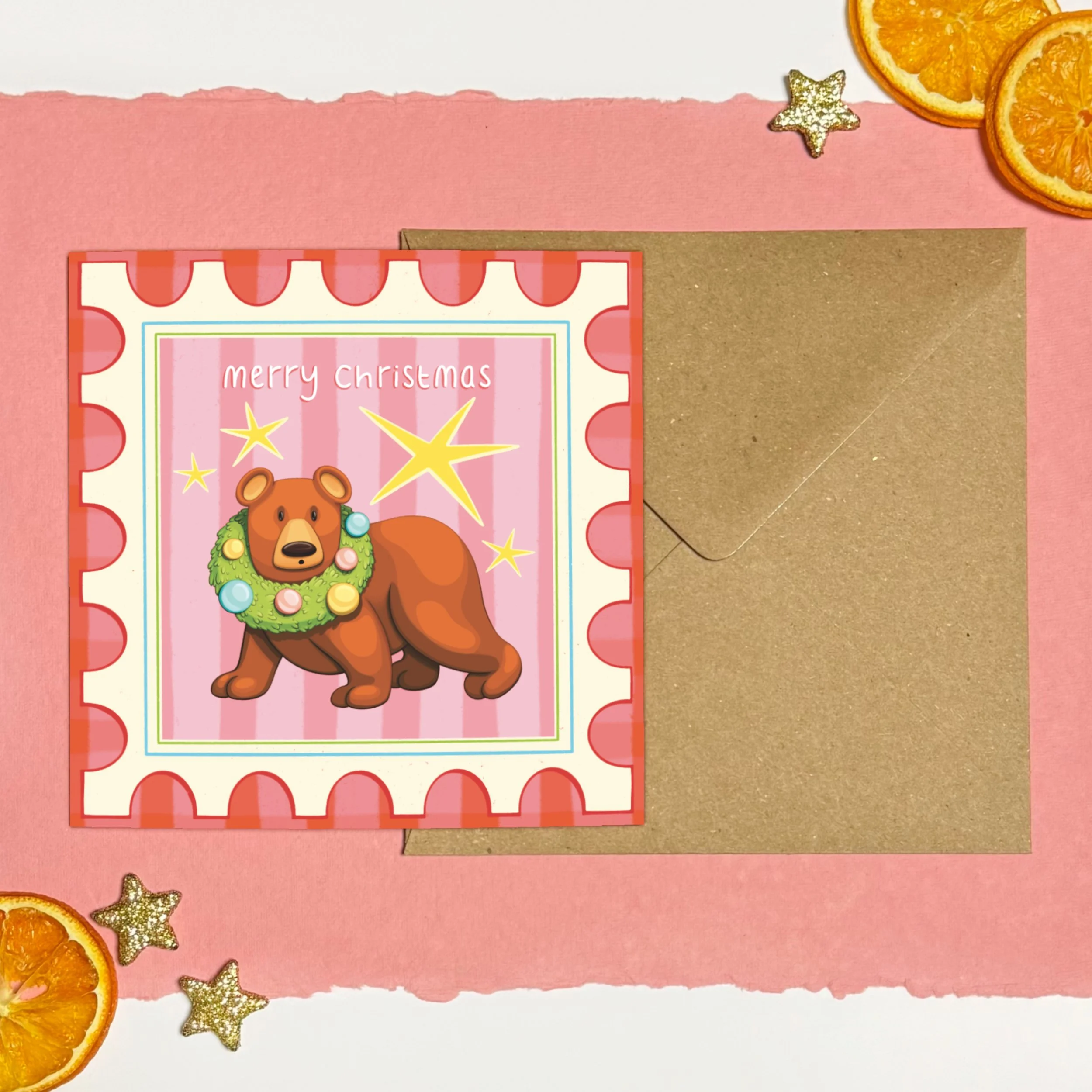 Bear with wreath round head yellow stars postage stamp illustrated Christmas card