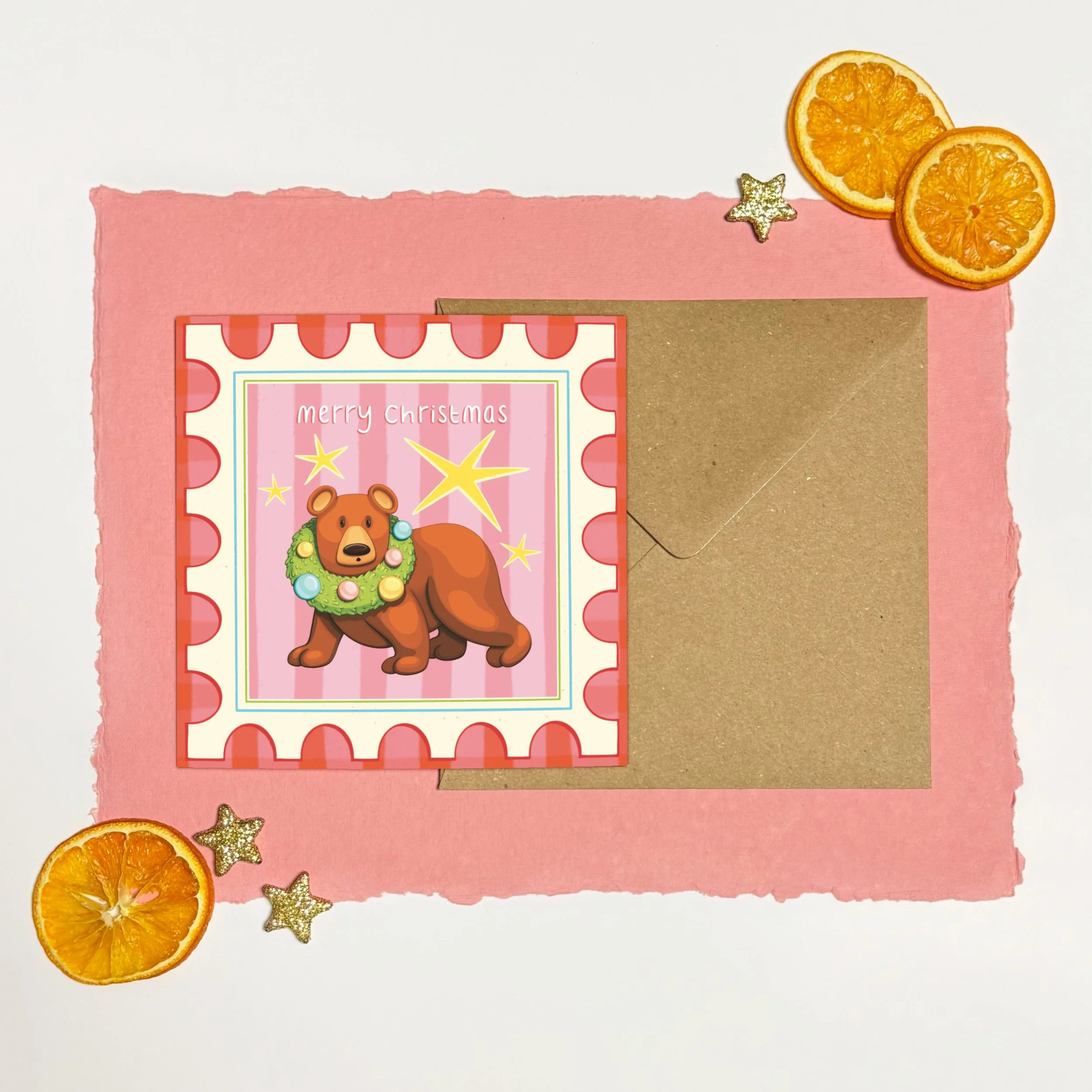 Bear with wreath round head yellow stars postage stamp illustrated Christmas card