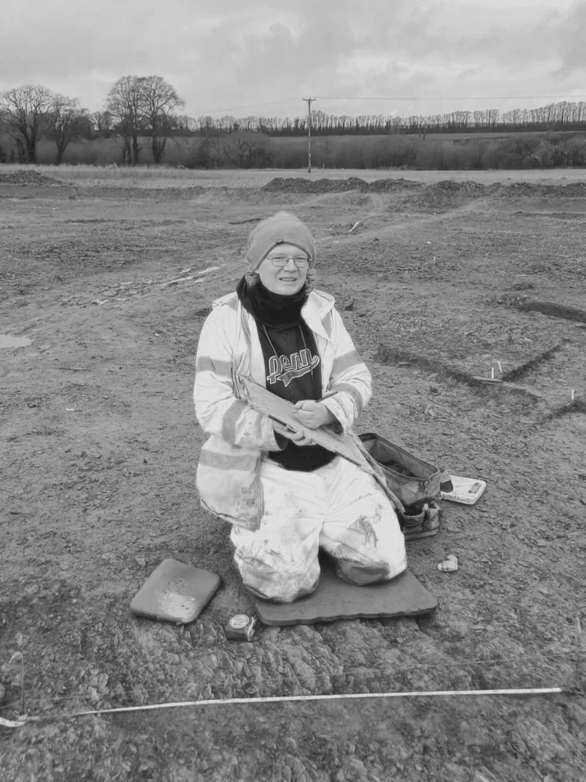 A grayscale placeholder image featuring a circular design with two overlapping semi-circular shapes.