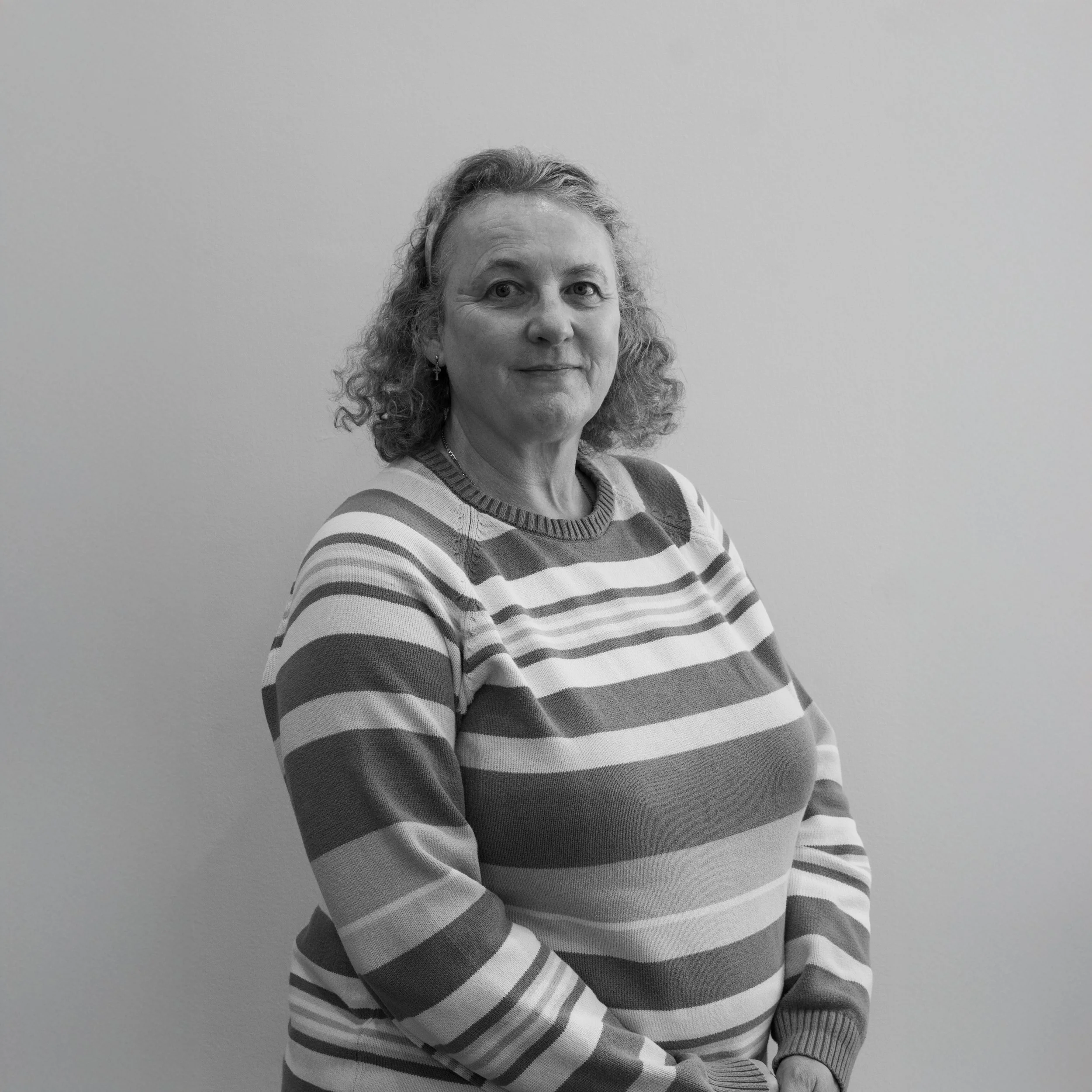 A gray and white abstract circular design resembling a target or concentric circles.