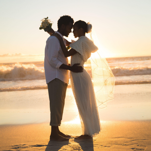 Couple embracing at their wedding, representing a qualifying life event for a Special Enrollment Period