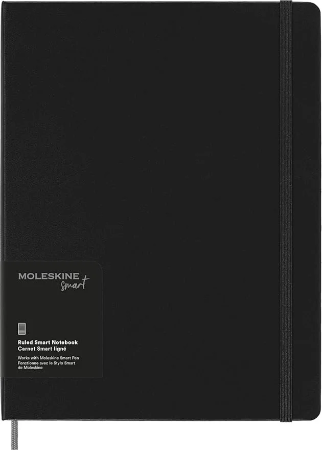 A black Moleskine smart notebook with an elastic closure strap and a gray ribbon bookmark.