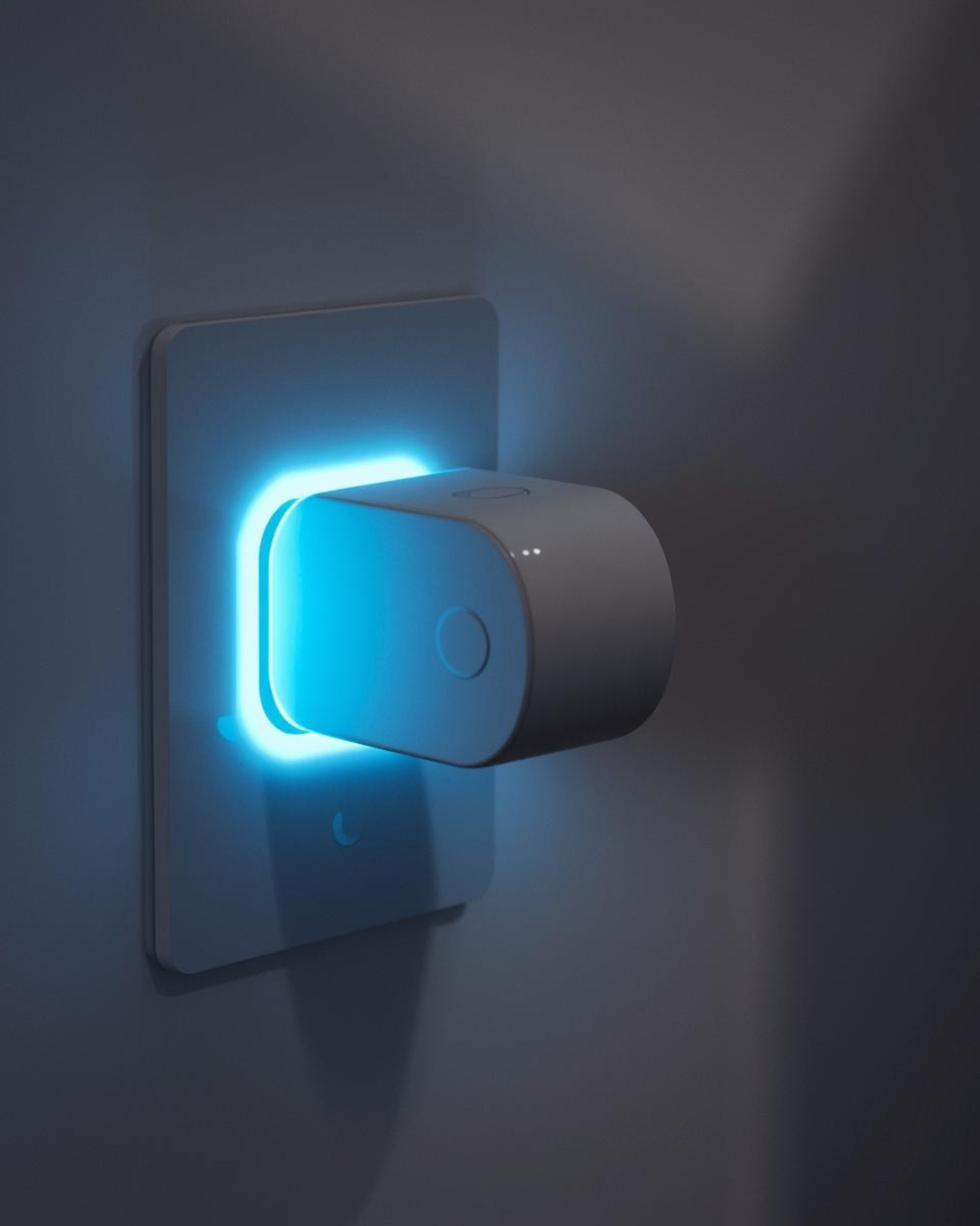Close-up of a modern smart plug with a blue LED light, plugged into a wall socket.