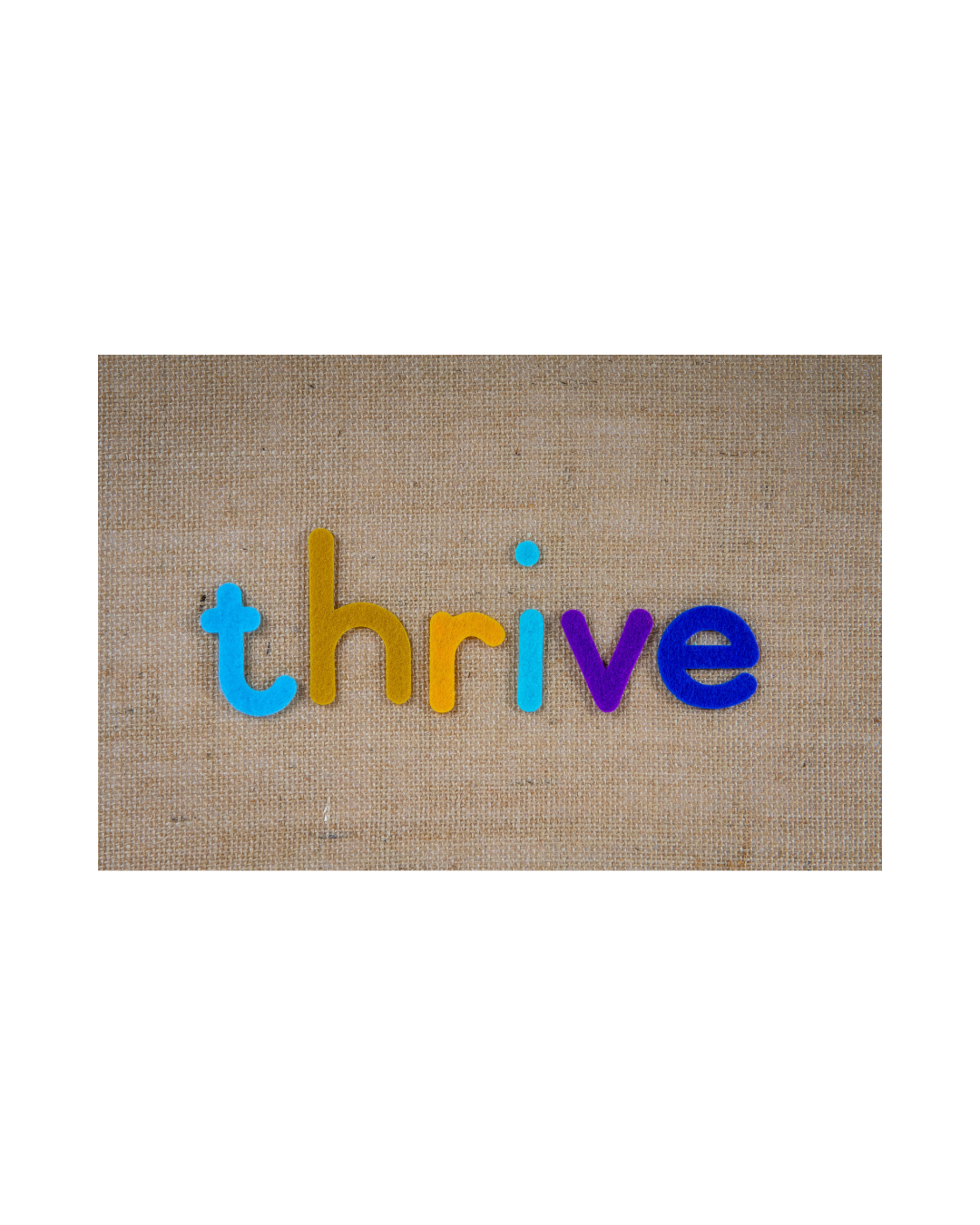 Colorful felt letters spelling 'thrive' on a textured beige background.