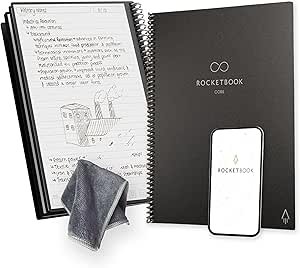 Rocketbook notebook, a white smartphone with Rocketbook logo, a gray cloth, and an open notebook with handwritten notes and sketches, all on a white surface.