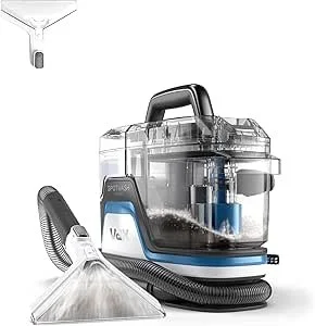 A vacuum cleaner with a transparent canister, hose, and attachments.