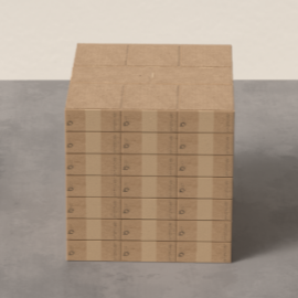 Stack of cardboard boxes with multiple horizontal sections, placed on a gray surface against a neutral wall.