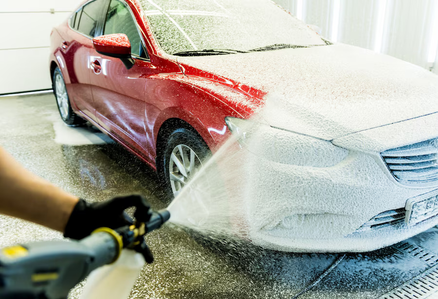 worker-washing-car-with-active-foam-car-wash_179755-10785.png