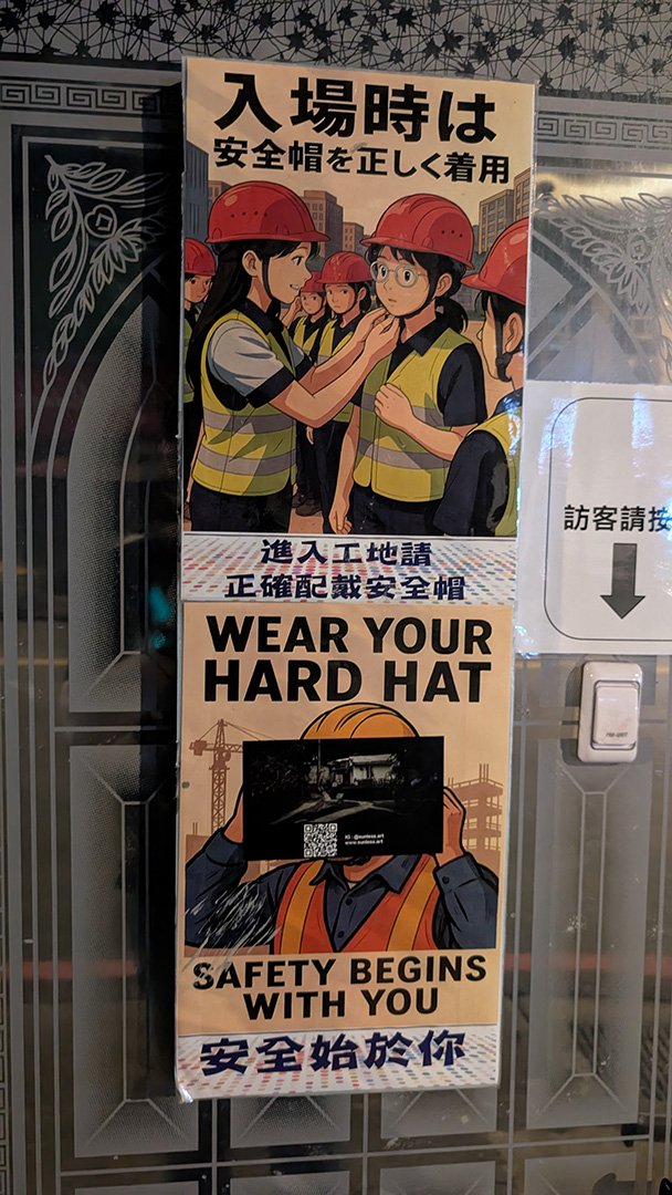 Safety posters in front of a building site
