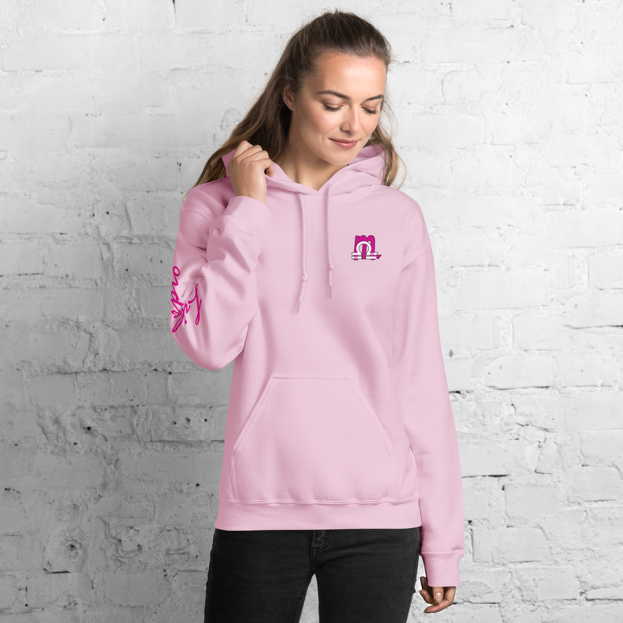 unisex heavy blend hoodie light pink with a magenta and white combined logo design of the Scorpio and Libra symbols on the front.