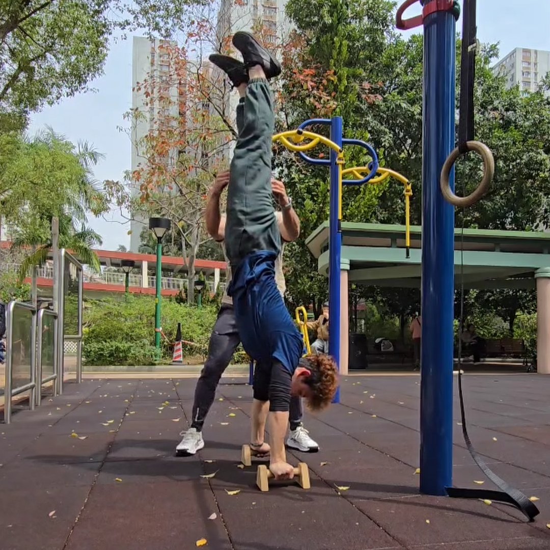 Training client handstand with a spot