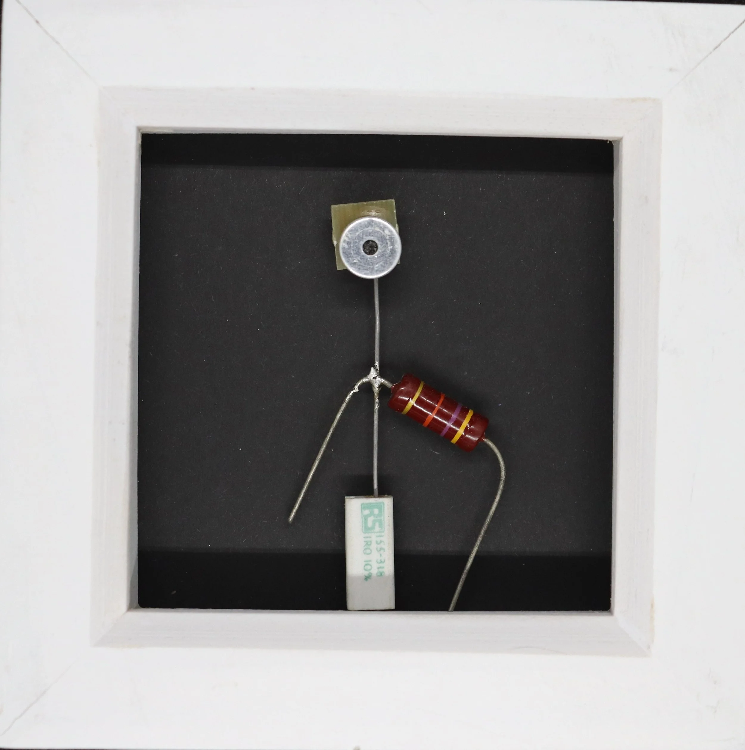 Inside a fire alarm pull station with wiring and electronic components visible.