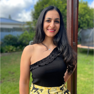 Nyla Khan, women's workshop facilitator, standing outdoors