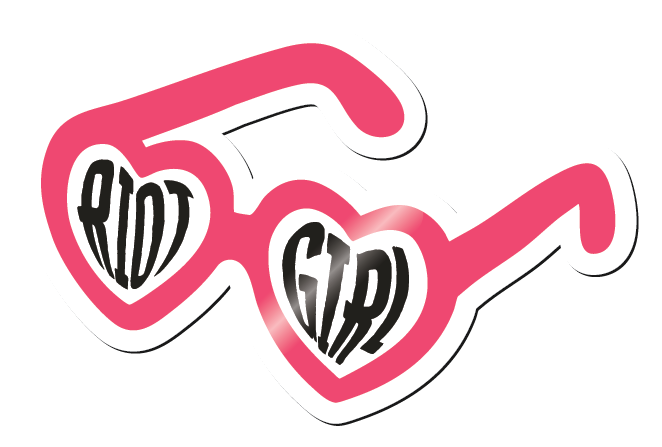 Pink heart-shaped sunglasses with black text reading 'Bad Girl' on the lenses