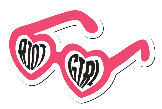 Pink heart shaped sunglasses, with the words 'RIOT' and 'GIRL' inside each heart