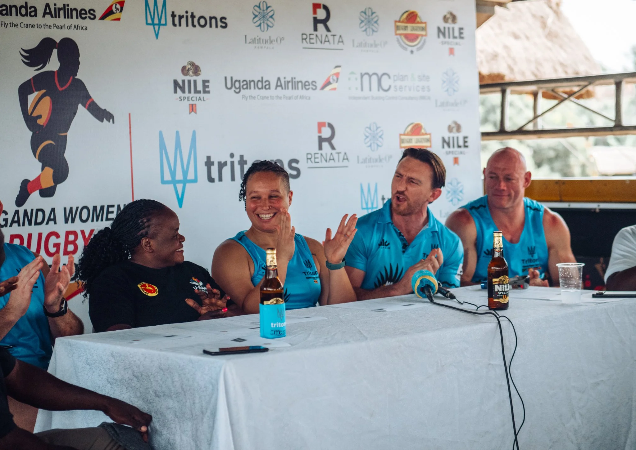Tritons Sports Tours press conference at Uganda women's rugby tournament with partners and sponsors
