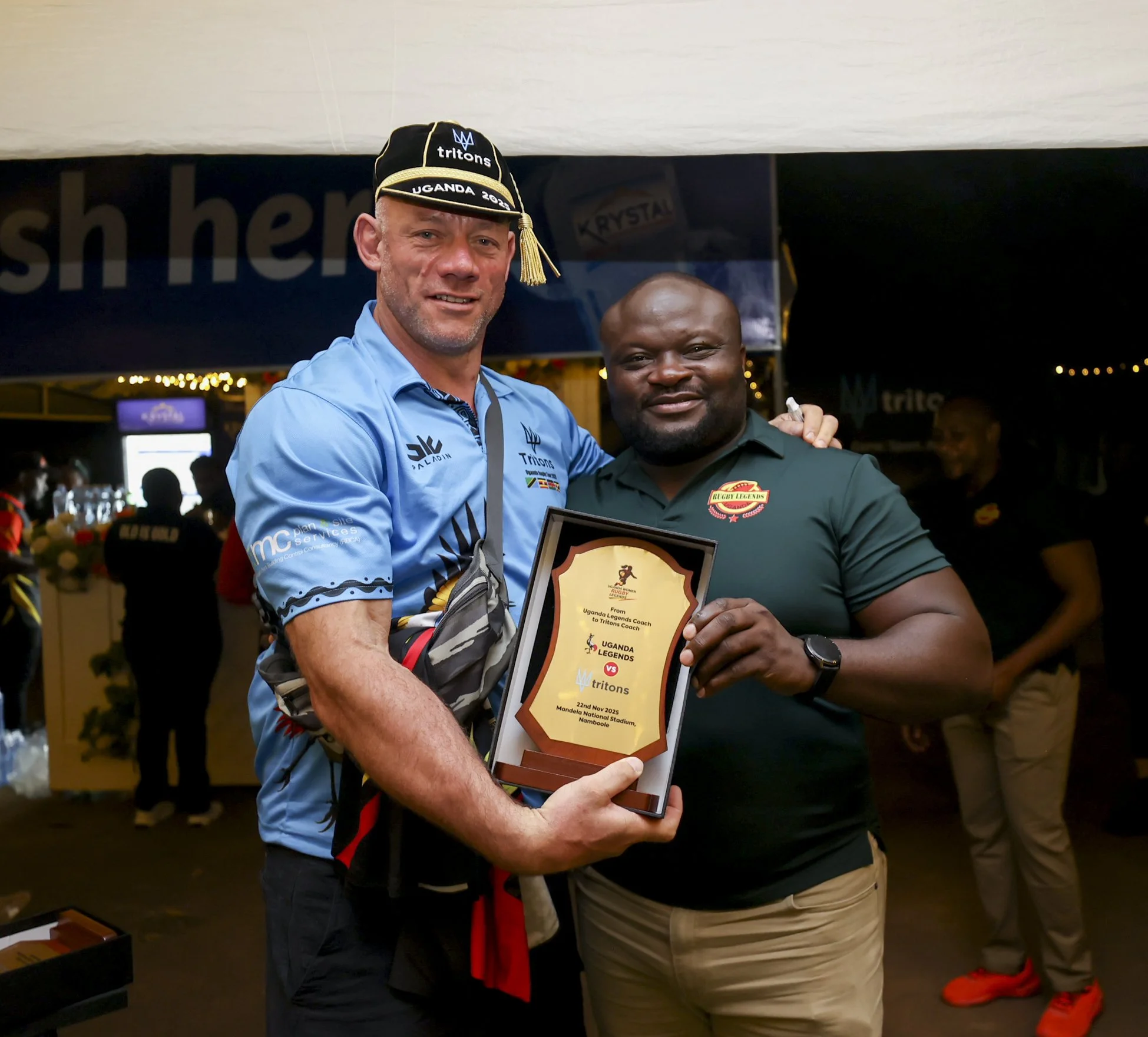 Tritons rugby tour award presentation with players and local partners.