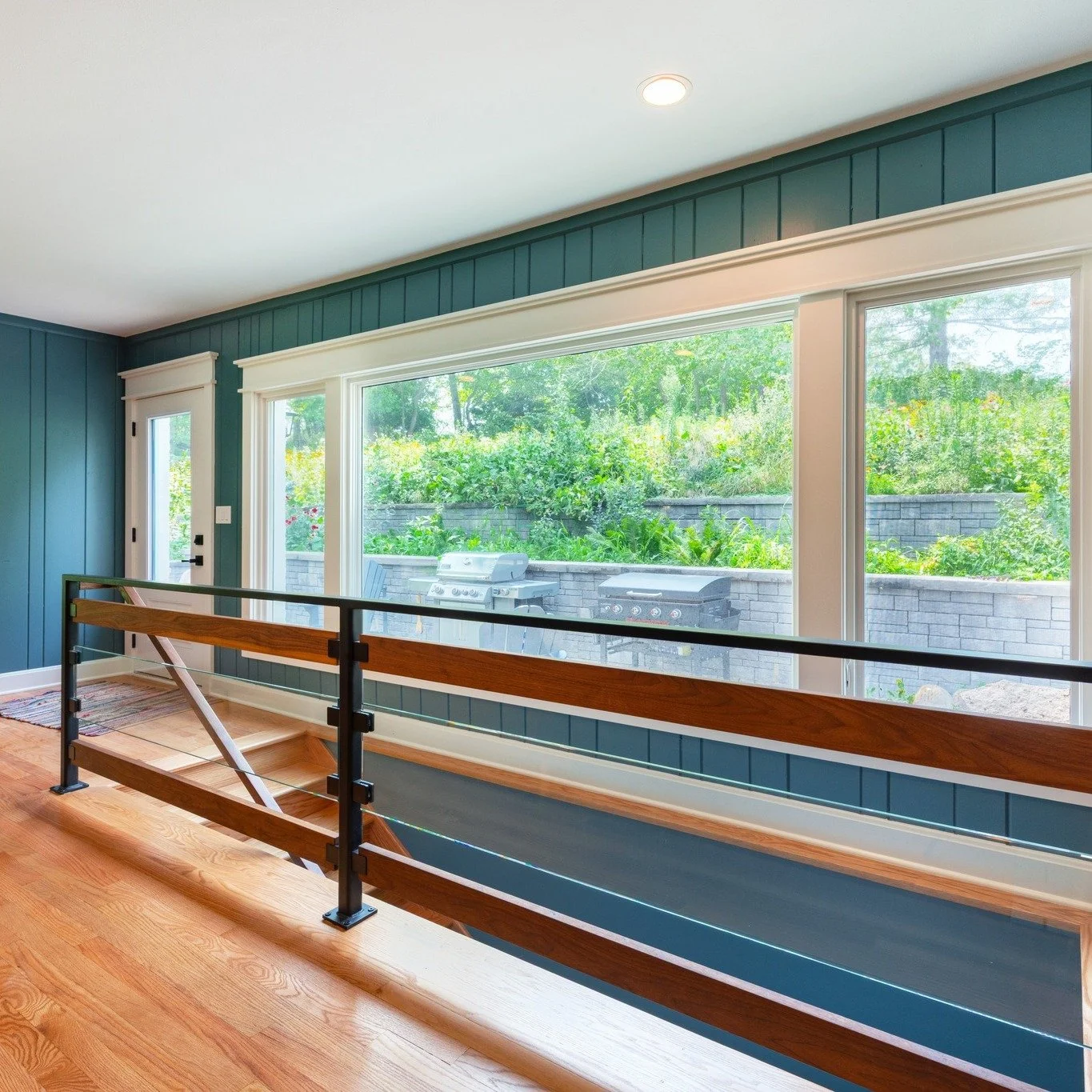 Big changes start with bold moves 👊 This custom staircase was completely relocated to open up space for our client&rsquo;s new kitchen. The mix of glass, metal, and wood ties the modern design right back to the home&rsquo;s original character.

 #bu