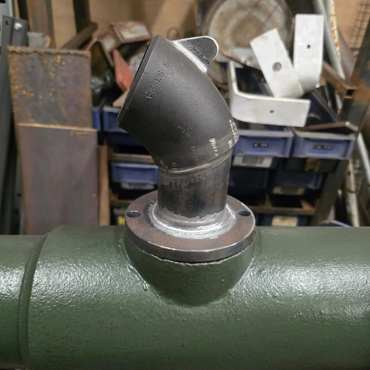 Spout and pivot pins.

Fabricated and forged in-house by our blacksmith Happy

Very little was left of the spout. Only about half of a cast iron flange and two wrought iron screws remained.

I kept it simple when fabricating the new spout. A 45&ordm;