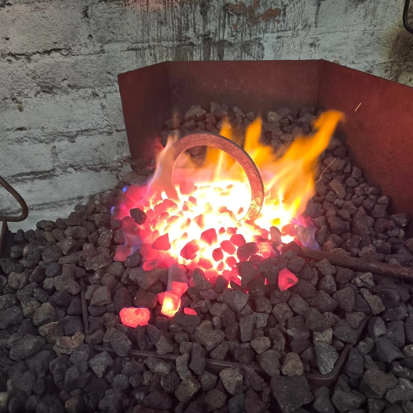Gasket rings

Produced in-house by our blacksmith Happy.

Once again the old fence provided the material for these parts. A rod was selected and drawn out thin. The side of the bar that would form the inside radius was bevelled to help mitigate any s