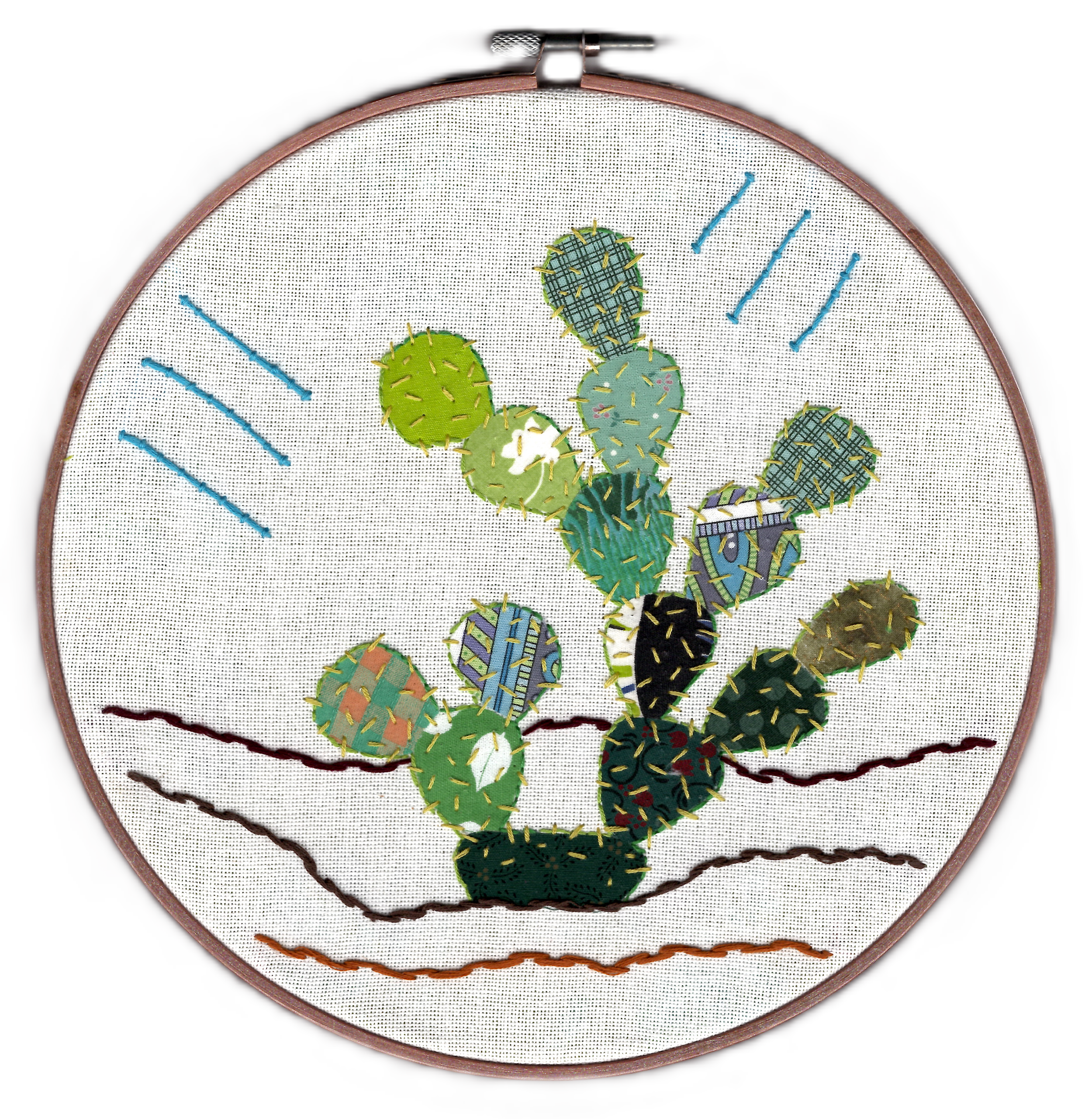 a colorful multi-patterned prickly pear cactus against a white background in a round embroidery hoop