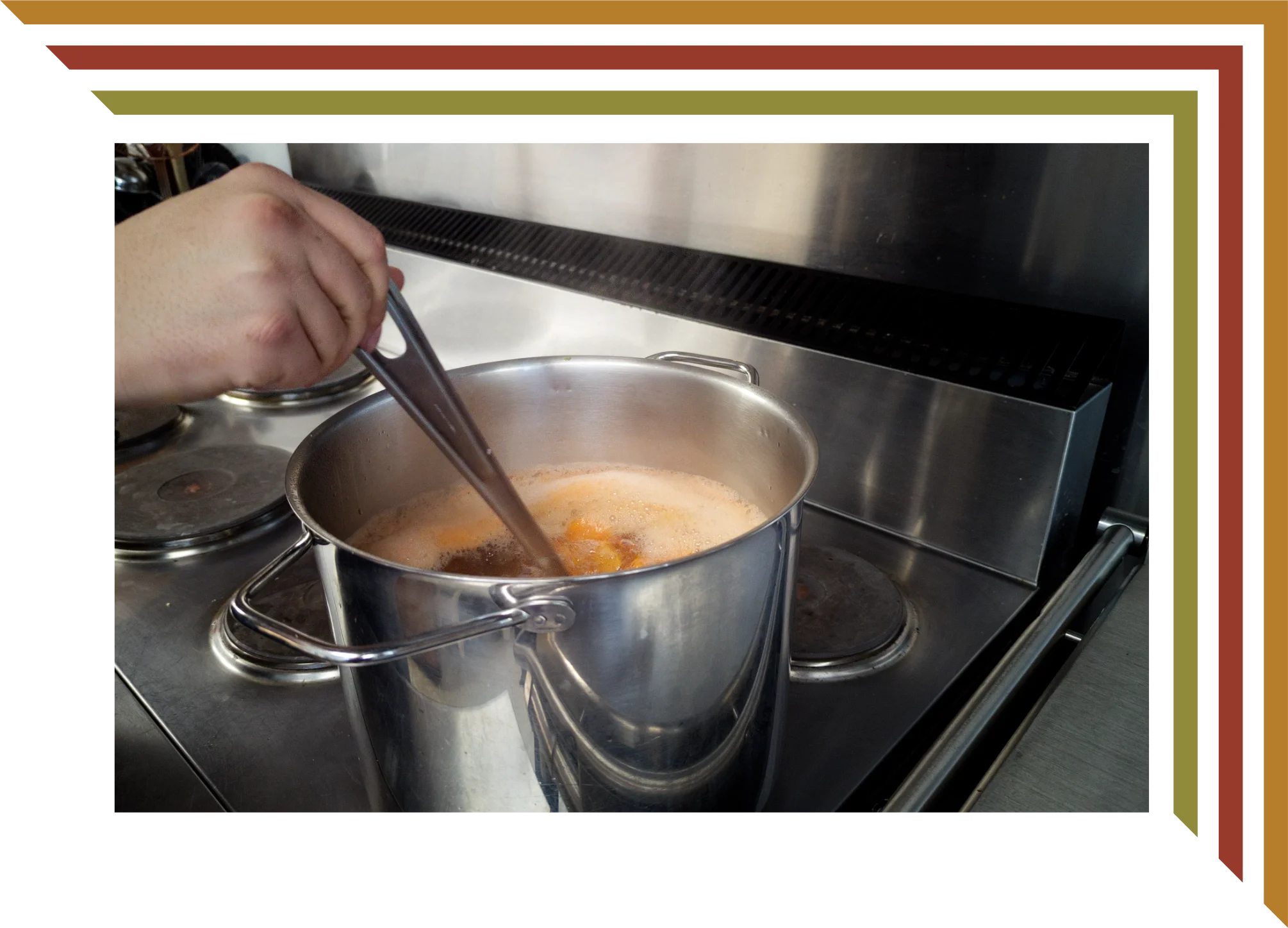 A person stirring a pot of soup or broth on a stove with a pair of tongs.