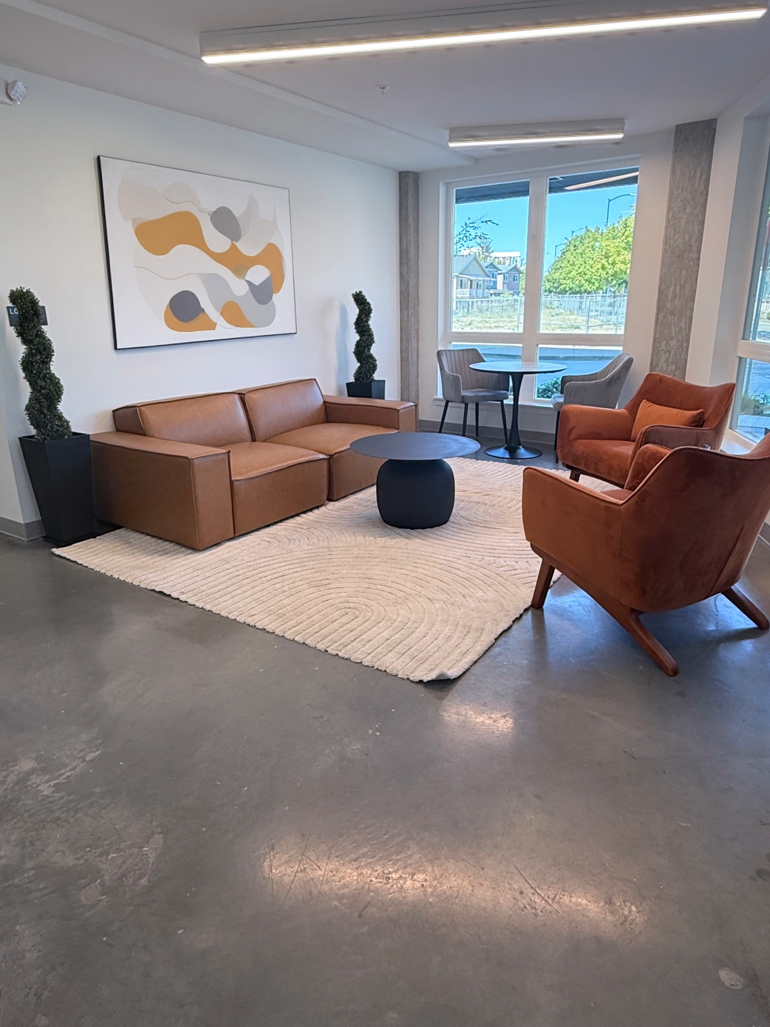 Shared community sitting and lounge area available to all residents, designed for relaxation, connection, and everyday comfort.