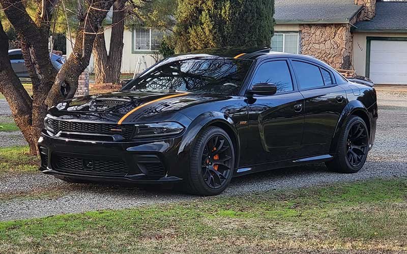 A black Dodge Charger with window tinting and PPF by Reeves Window Tinting in Redding, CA
