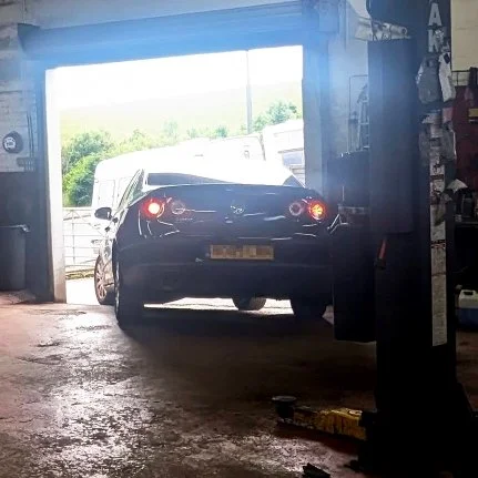 Car leaving Harris Motors Woodingdean