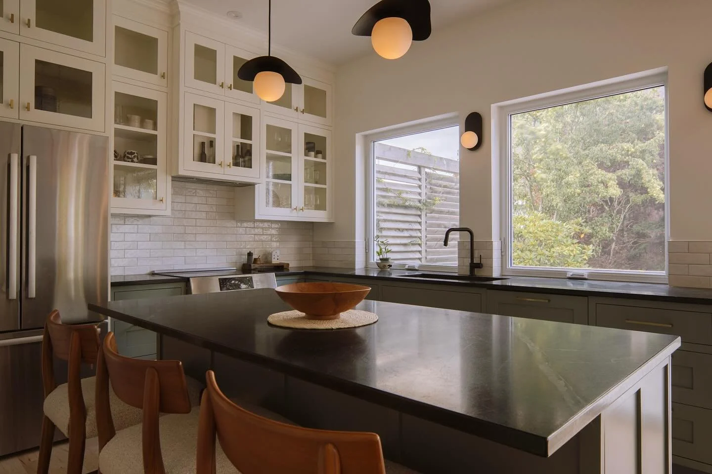 Phase 2 on our central Halifax project was completed this spring. The existing kitchen was dreary and awkward. 
We remedied that by adding two large windows and a large sliding door from @southendwindows out to the back deck on the north side.  Along