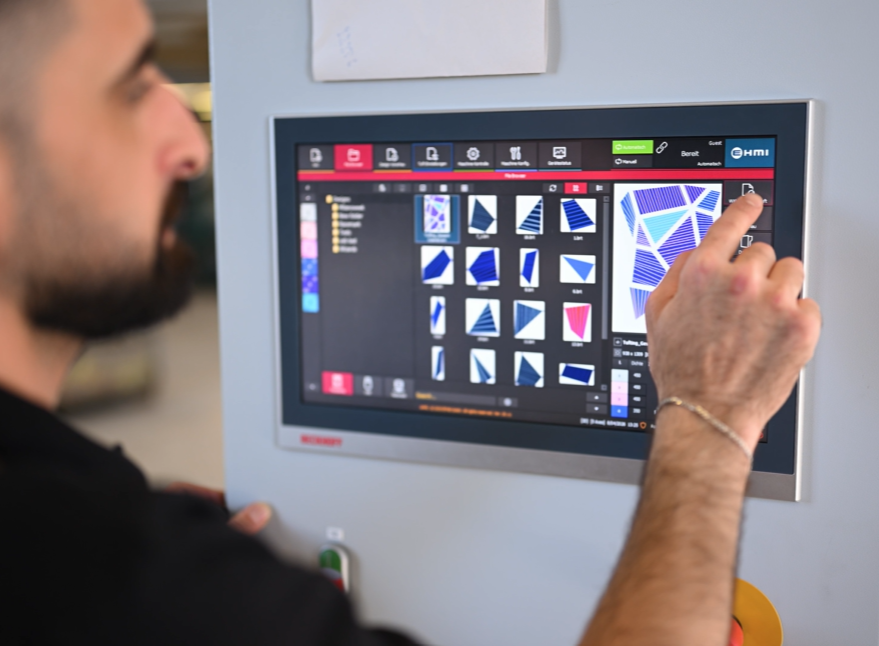  A digitalization of the mountain design is made and programmed into the CNC tufting machine.  