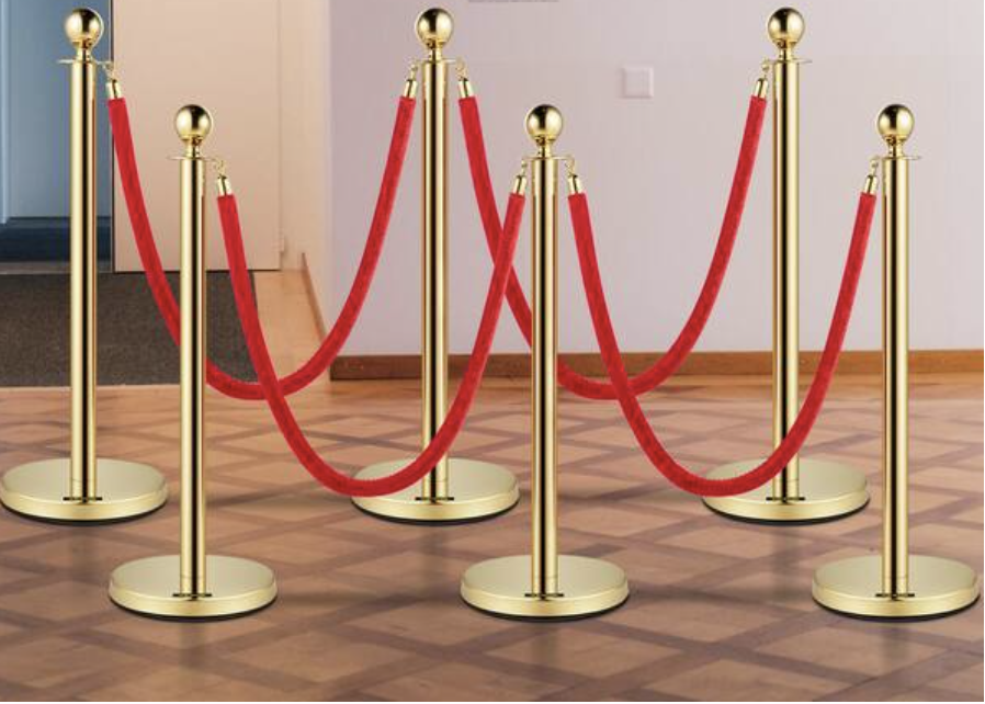 Gold stanchions with red velvet ropes for party and event rentals on Long Island