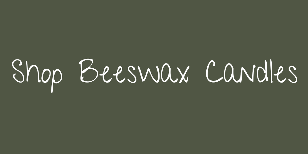 Sign with the text 'Shop Beeswax Candles' on a dark green background.