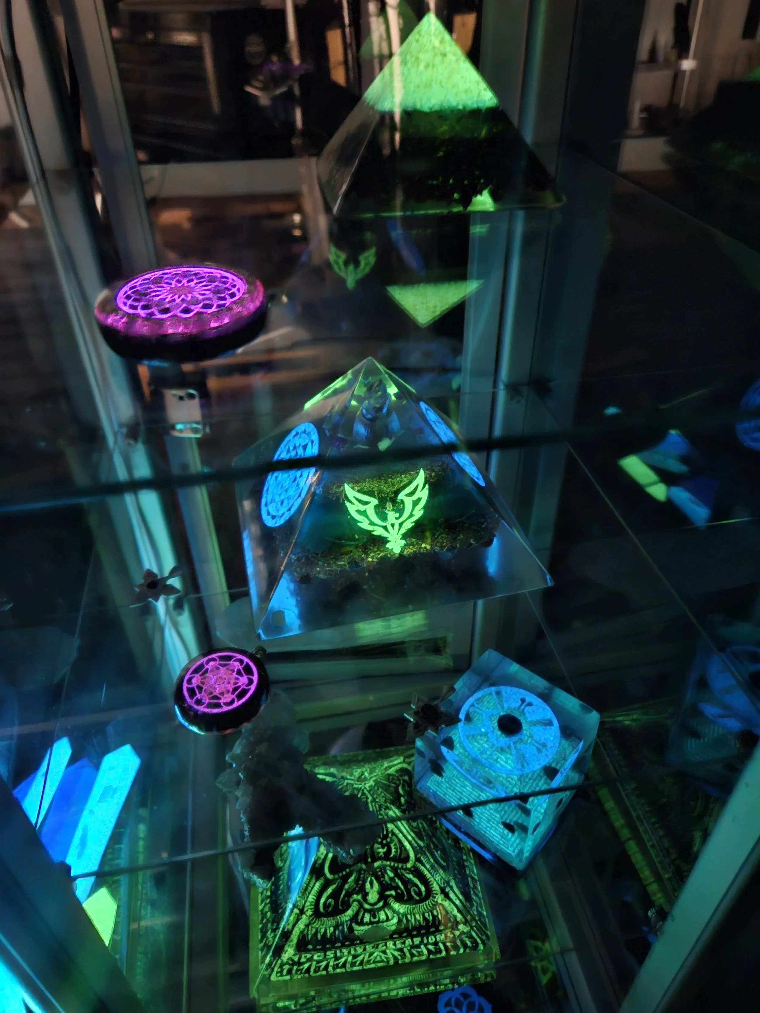 Orgonix studio shelves displaying orgonite pyramids