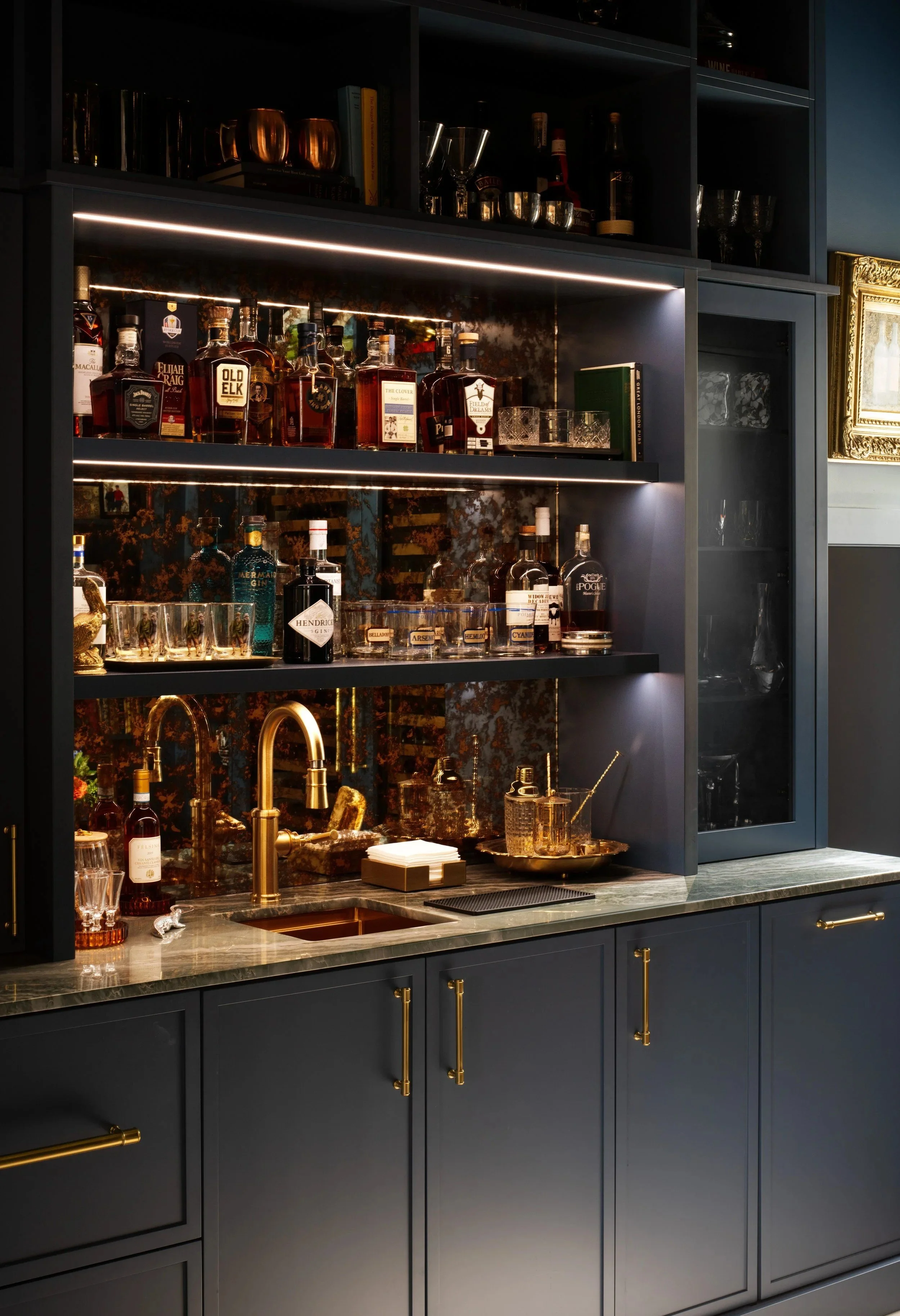 Custom home bar with lit glass shelving by BUILT, Tampa