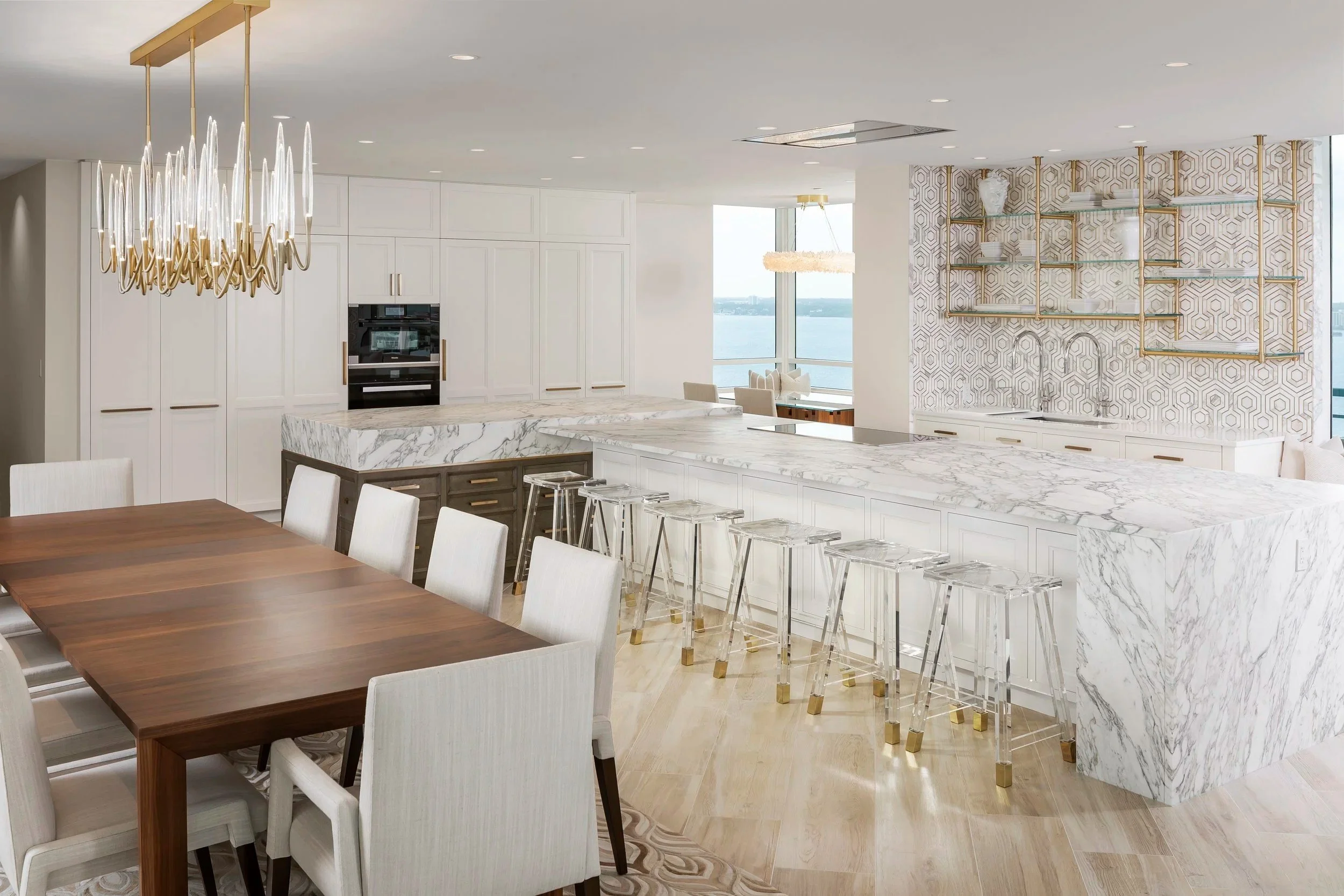Custom kitchen island and millwork in a waterfront residence by BUILT