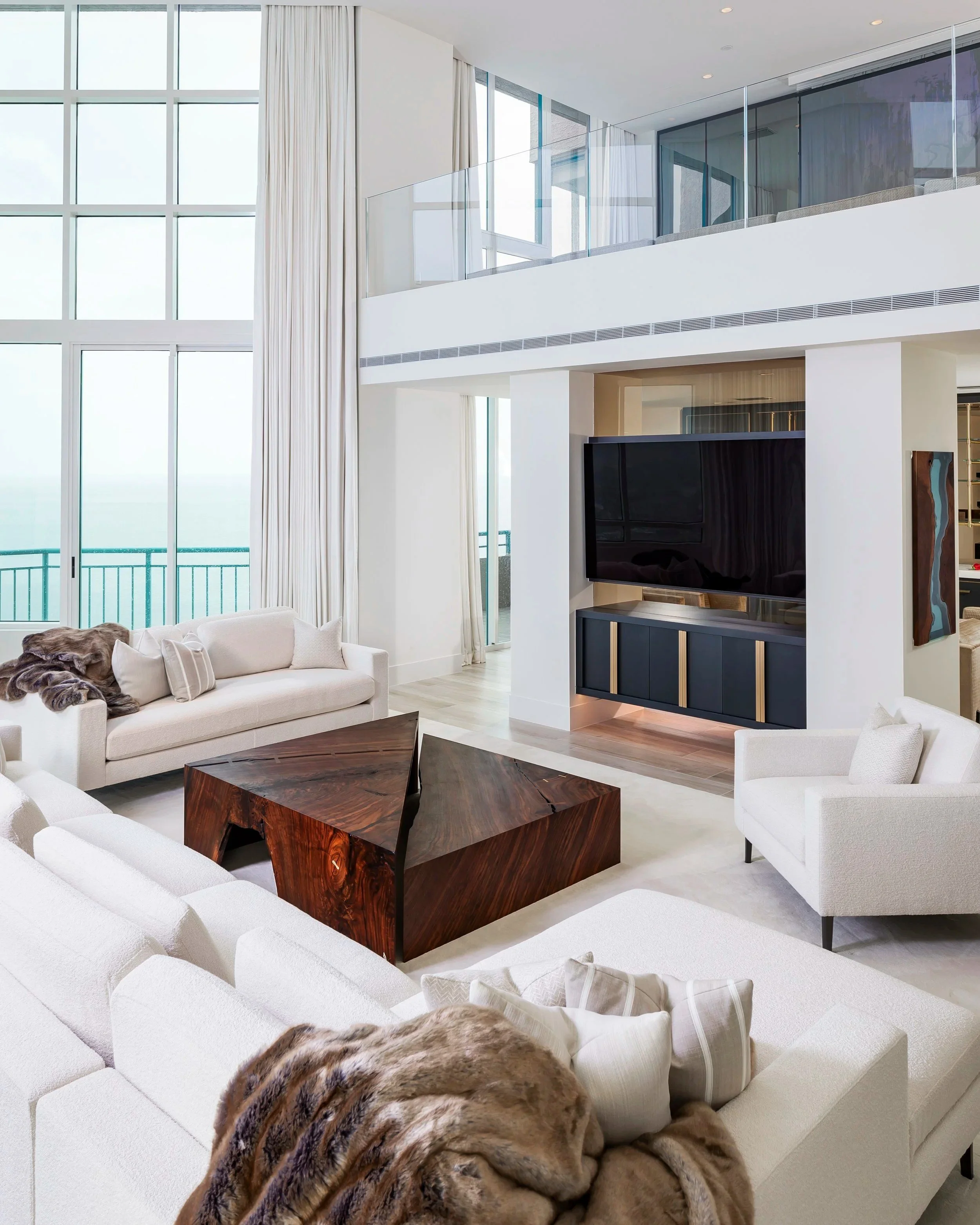 Waterfront living room with custom millwork by BUILT