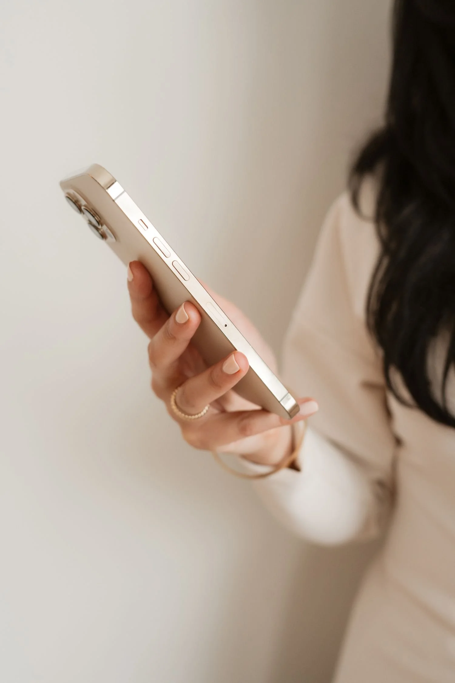 woman holding a cell phone in her hand